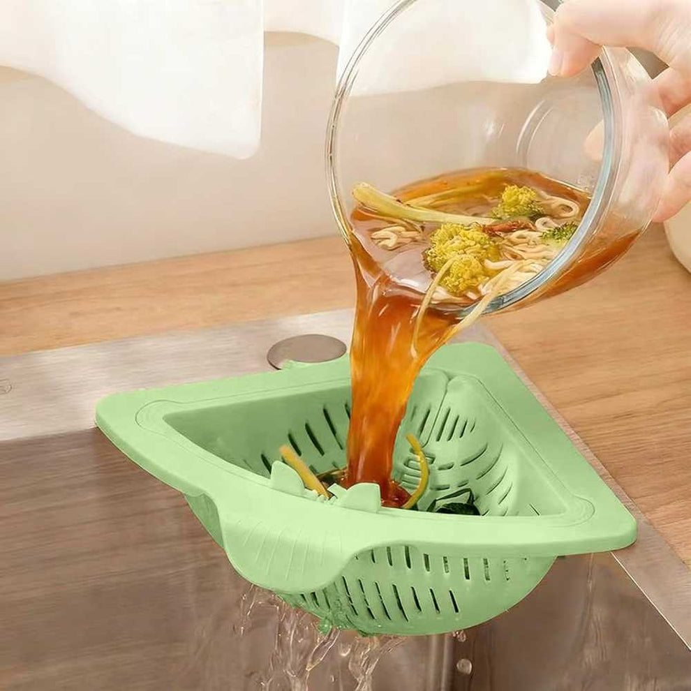 Sink strainer basket catching food scraps and vegetable peels